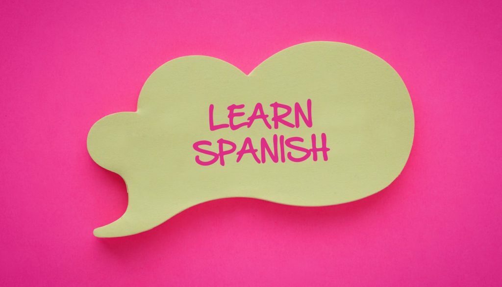 the words Learn spanish on a post it note